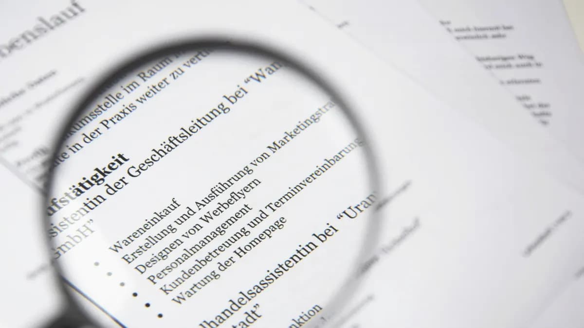 Magnifying glass over the fine print of a contract — reading a value-protection clause closely